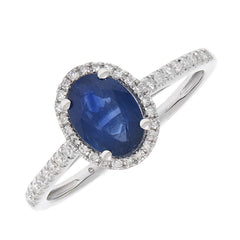 Anillo zafiro rodeado y brillantes en la argolla. Tot  0,56 cts